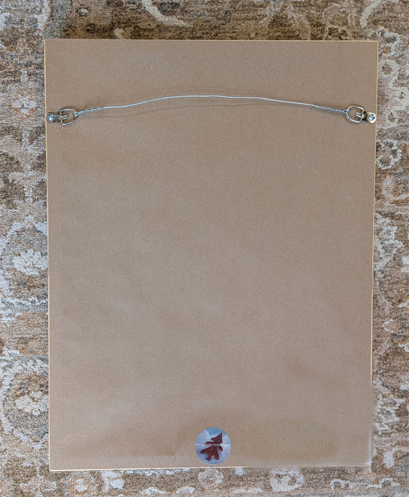 Oasis back of painting with framing hardware